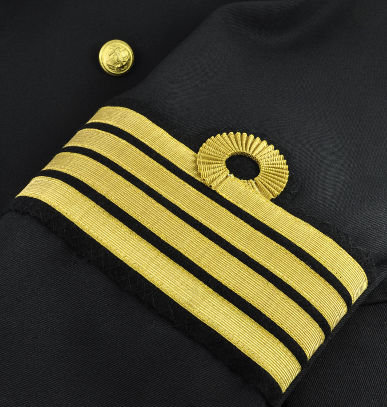 Golden stripes on the sleeve of a captain's uniform